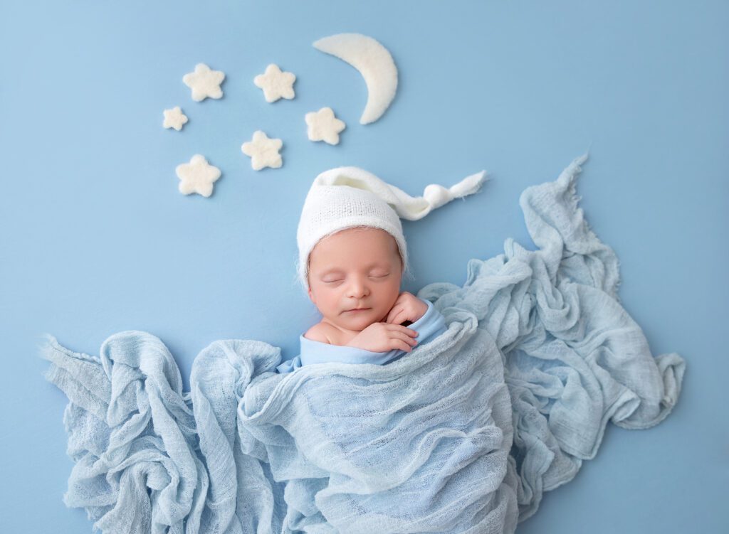 Newborn baby on blue blanket with stars pictures Brooklyn NY